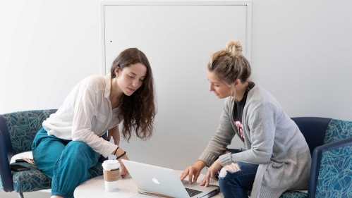 Students looking at computer