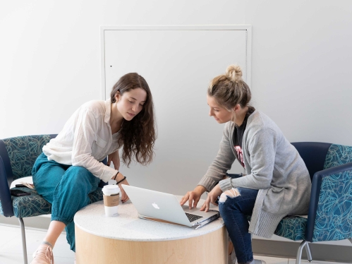 Students looking at computer