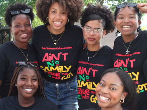 A group of students wearing PRCC-branded shirts that say "Ain't No Family Like the One We Got"
